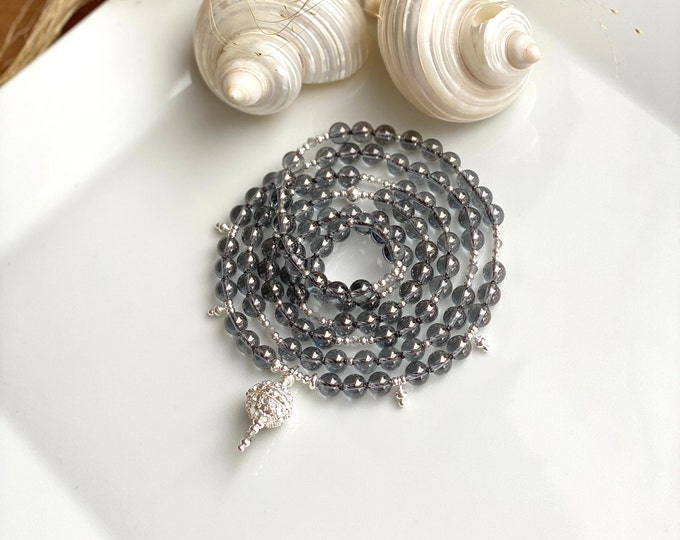 Mala made of silver aura quartz, decorated with sterling silver, end bead with sterling silver ornaments, shimmering prayer beads