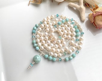 Mala made of Larimar, white freshwater pearls and bright apatite, decorated with silver, final pearl Larimar, precious prayer beads