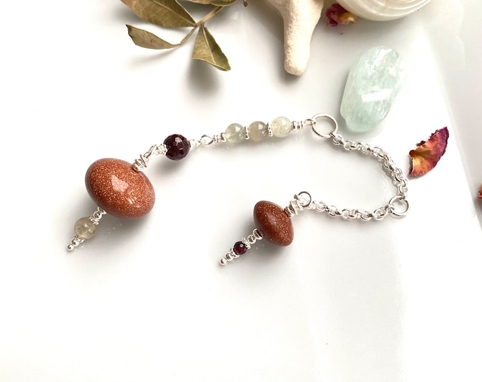 Pendulum made of goldstone, garnet, moonstone and silver, radiesthesia