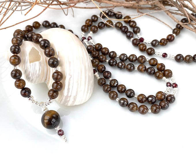 Bronzite mala decorated with garnet and silver, tiger's eye final bead