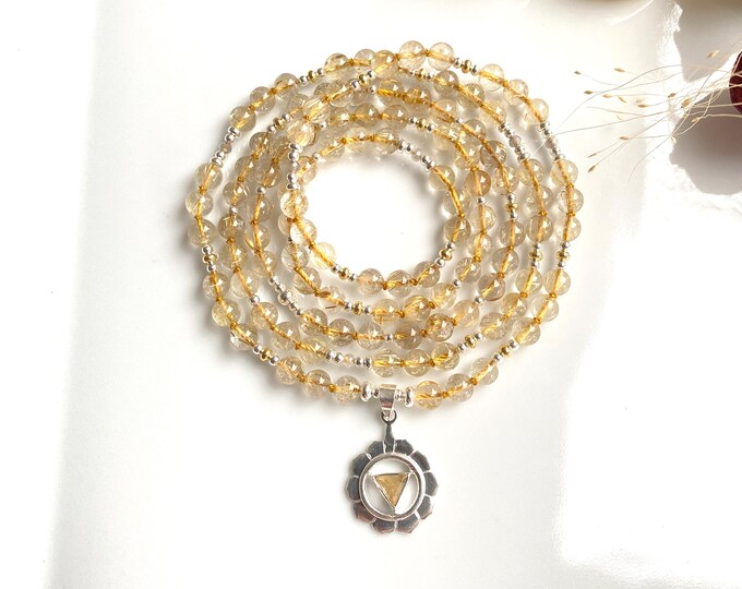 Mala Manipura - Rutilated Quartz, prayer beads made of golden Rutilated Quartz with a silver pendant with a symbol for the solar plexus chakra, prayer beads