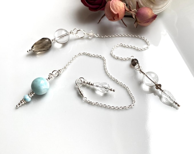 Res for K..: Pendulum made of smoky quartz and rock crystal and of Larimar with rock crystal with sterling silver, handmade, radiesthesia
