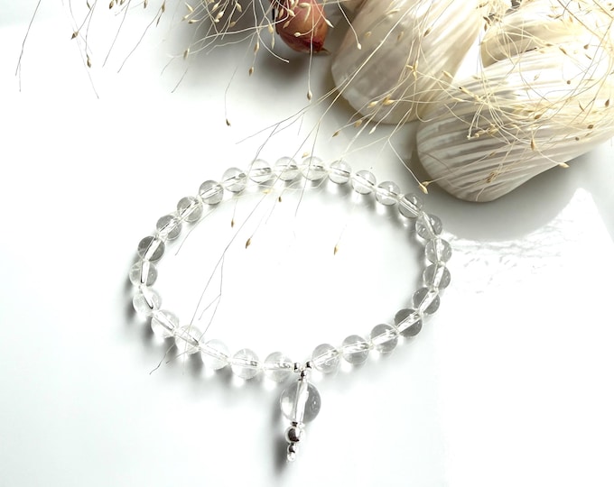 For K.: Finger Mala with 27 beads and a guru bead made of rock crystal, decorated with silver