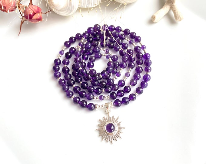 Mala made of amethyst with a silver pendant with the crown chakra symbol - Sahasrara, prayer beads