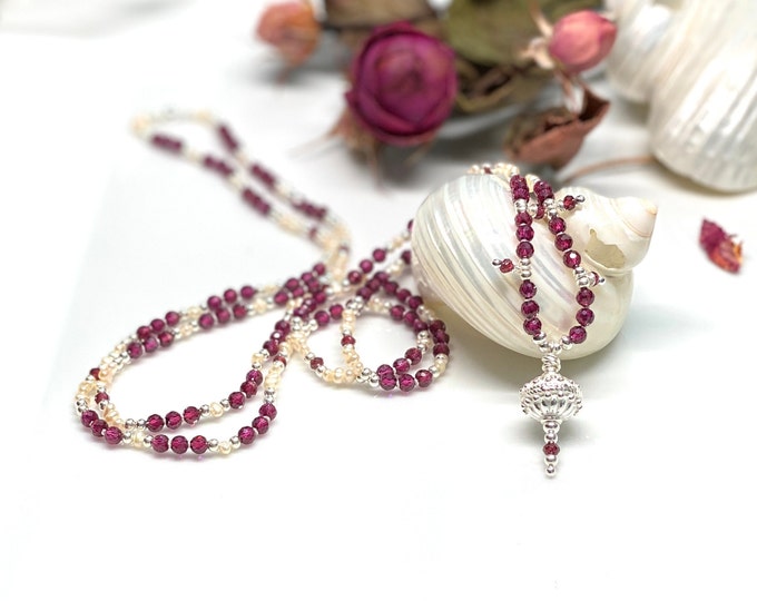 Delicate mala made of violet garnet, decorated with silver, freshwater pearls and violet garnet, final element ornamental silver bead