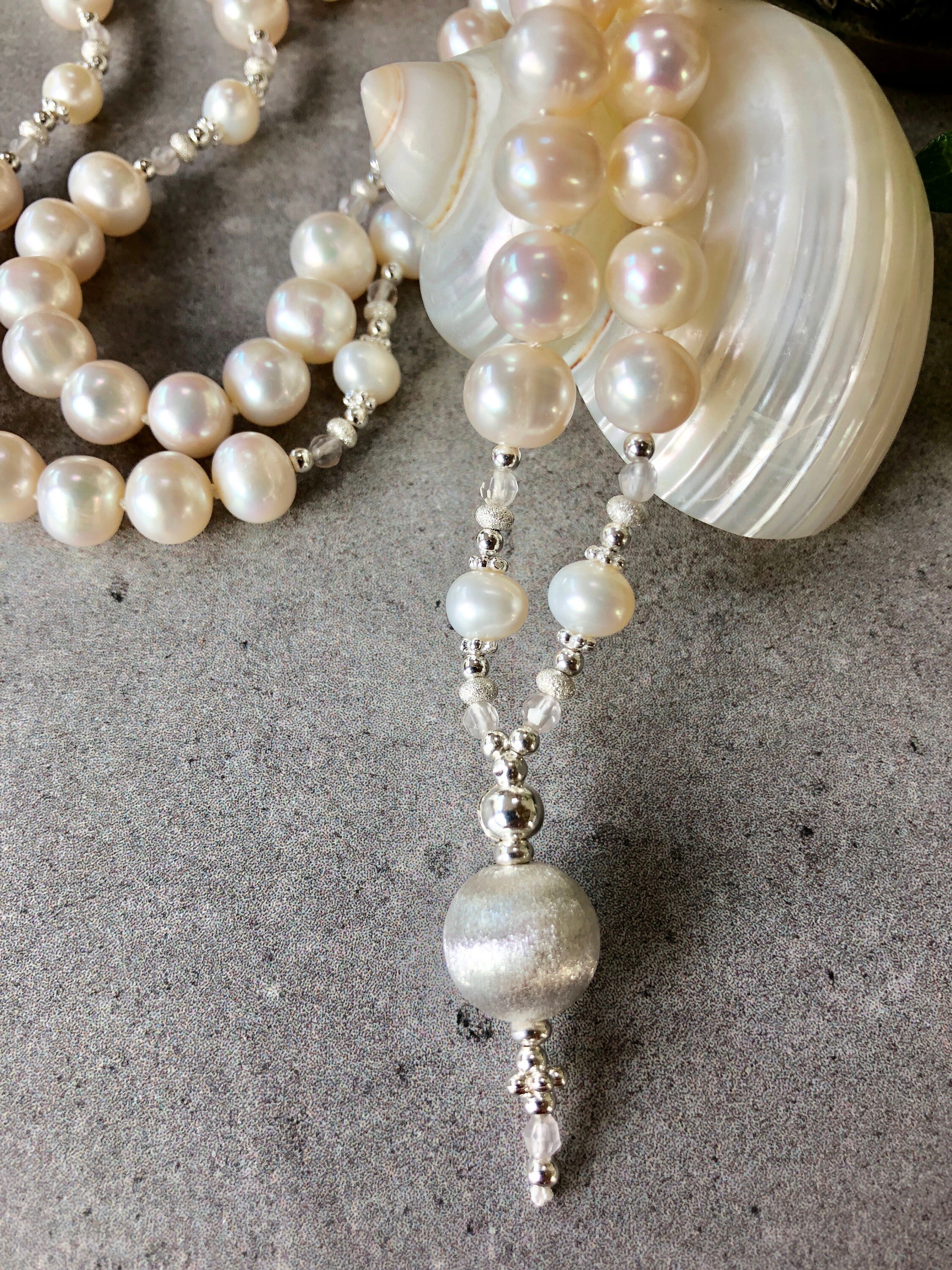 Long mala from 108 freshwater pearls decorated with silver (sterling)
