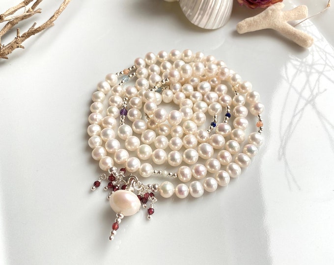 Mala made of freshwater pearls (A), decorated with silver and small chakra stones, with carabiner and final pearl