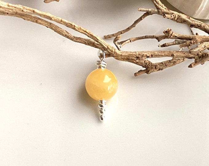 Pendant made of orange calcite and silver, simple and timeless, small gift