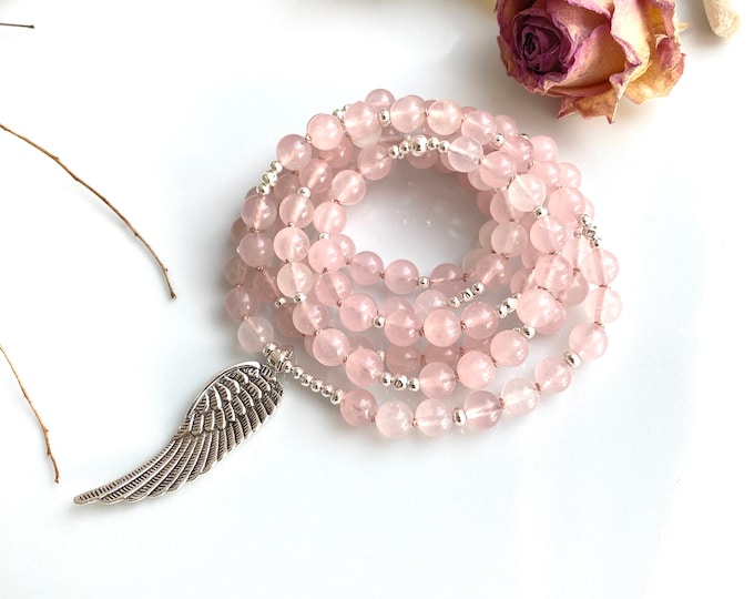 Mala necklace made of rose quartz with angel wings in silver as the final element
