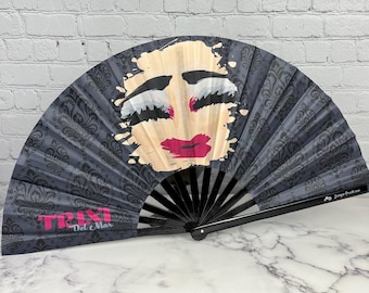 Trixi Del Mar and Her Drag Queen Makeup Smashed Onto a Large Clack Fan Designed by Tara Vojta, Manufactured In a Small Limited Edition Run