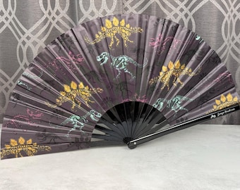 Dino Skeleton Color Skulls Printed on a Large Clack Fan Designed by Tara and Manufactured in Small Limited Edition Batches