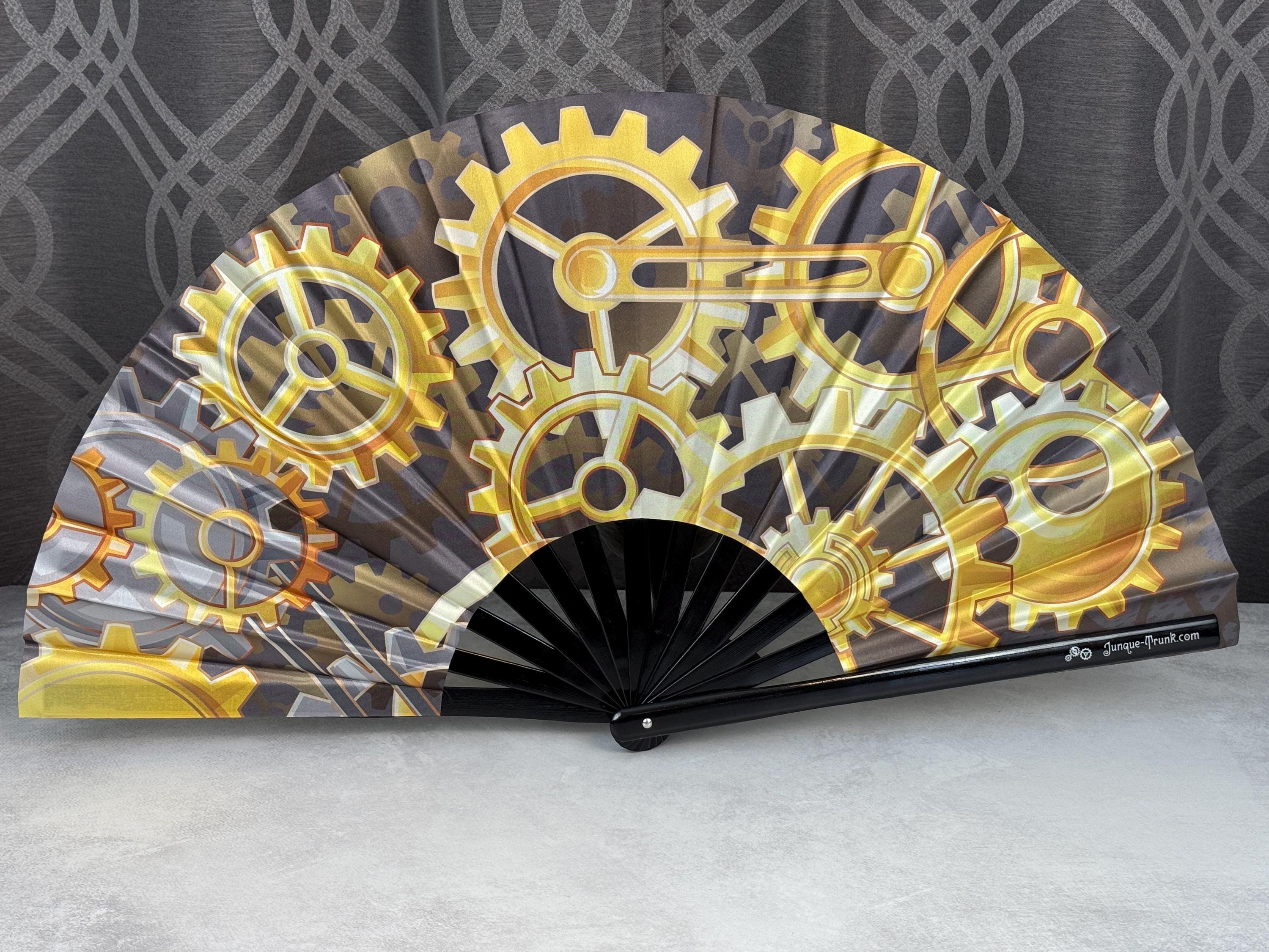 Steampunk Gears of Golden Yellows on a Large Clack Fan Designed by Tara and Manufactured in Small Limited Edition Batches