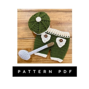 May include: Crochet pattern PDF for a green and white baby outfit with a matching hat and a golf club. The outfit is designed for a newborn baby.