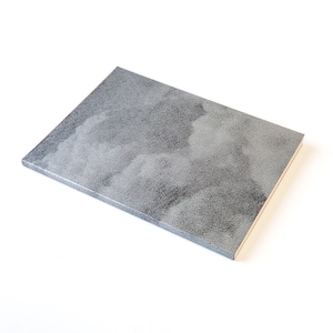 May include: A grey notebook with a textured cover. The cover has a subtle pattern of light grey clouds.