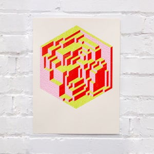 May include: A geometric abstract print with a pink, yellow, and red color scheme. The print features a 3D cube with overlapping lines and shapes.