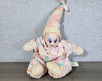 small but knowing clown doll