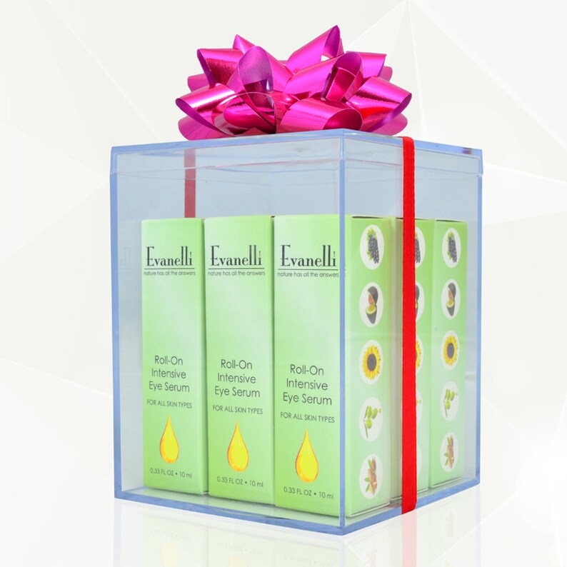 May include: Three clear plastic bottles of Evanelli Roll-On Intensive Eye Serum in a clear gift box with a pink bow. Each bottle is 0.33 fl oz (10 ml).