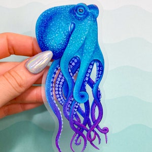 May include: A blue and purple octopus sticker with a clear background. The octopus has a detailed, textured body and tentacles.