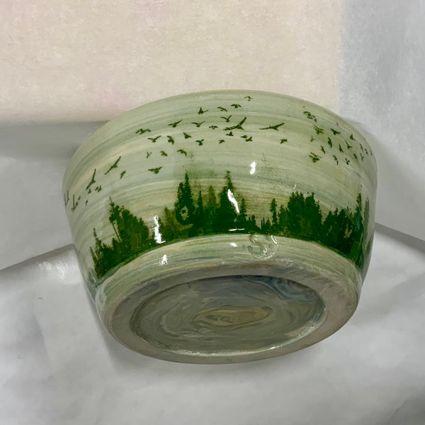 Handmade wheel thrown colored clay green bowl with bird details made of porcelain high fired for durability.