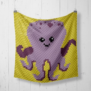 May include: A crocheted blanket with a purple octopus design on a yellow background. The octopus has a smiling face and eight tentacles.