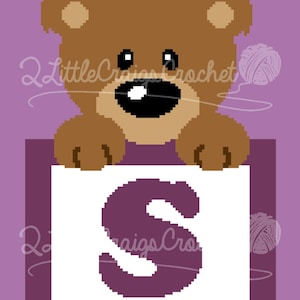 May include: A brown bear peeking over a white square with a purple letter S on it. The background is purple.