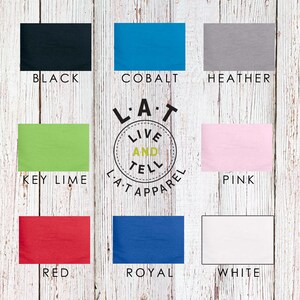 May include: A chart showing 10 different color options for a t-shirt. The colors are black, key lime, cobalt, heather, pink, red, royal, and white. The chart also includes the text "L.A.T Live and Tell Apparel."