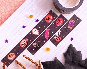 May include: Four rolls of black and white Halloween themed washi tape with various spooky and cute designs. The designs include ghosts, pumpkins, bats, and cookies.