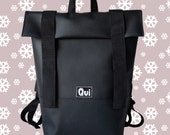 Black leatherette unisex city backpack with black straps. Everyday handy leatherette bag rucksack with zippered pockets