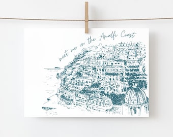 May include: A black and white sketch of a coastal town with the text "meet me on the Amalfi Coast" written in cursive.