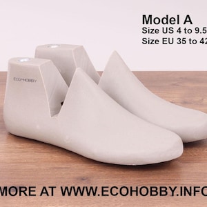 May include: A pair of beige shoe stretchers, made of plastic, with the text "ECO HOBBY" printed on the side. The stretchers are designed to help maintain the shape of shoes and prevent creases. Model A, Size US 4 to 9.5, Size EU 35 to 42. MORE AT WWW.ECOHOBBY.INFO