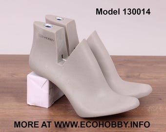 May include: A pair of gray shoe forms, one on top of the other, with the text "ECO-HOBBY" printed on the side. The shoe forms are labeled "Model 130014".