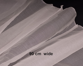 May include: White sheer fabric, 90 inches wide, folded in thirds. The fabric is lightweight and translucent.