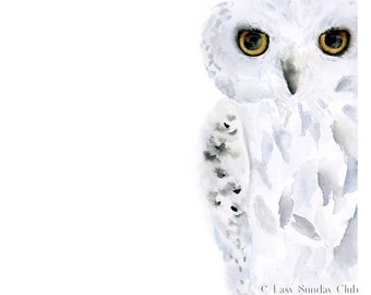 May include: A watercolor painting of a snowy owl with yellow eyes. The owl is facing the viewer and is partially obscured by the edge of the image. The background is white.