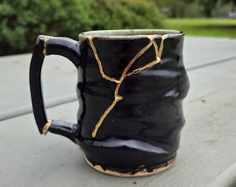Handmade Black Gloss Ceramic Mug: Kintsugi Inspired Gold Repair