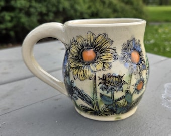 Functional handmade ceramic coffee mug with flower print
