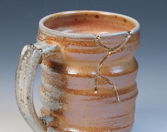 Wood and soda fired cone 10, wabi sabi and kintsugi inspired fully functional handcrafted ceramic coffee or tea mug with real gold luster