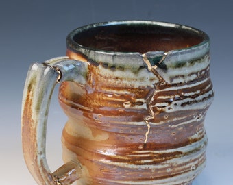 Wood and soda fired cone 10, wabi sabi and kintsugi inspired fully functional handcrafted ceramic coffee or tea mug with real gold luster