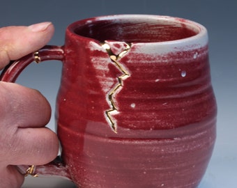 Kintsugi inspired red glazed wabi sabi functional handmade ceramic coffee or tea mug with real gold luster