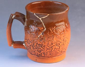 Kintsugi, Wabi Sabi, handmade ceramic coffee or tea mug with decorative 22k gold repair