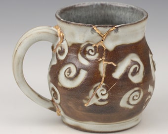 Kintsugi, Wabi Sabi, Japanese inspired functional handmade ceramic coffee or tea mug with decorative 22k real gold repair and swirl texture