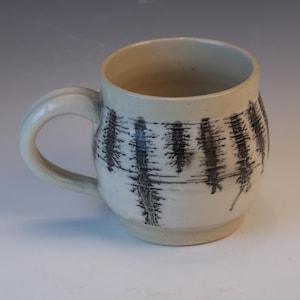 Black and white mocha ware style blue glazed functional handmade ceramic coffee or tea mug.