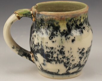 Kintsugi, Wabi Sabi functional handmade black and white ceramic coffee or tea mug with 22k gold decorative gold repair
