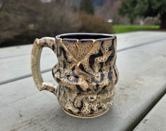 Handmade Kintsugi Inspired Ceramic Mug, black and Tan, Simulated 22k Gold Repair