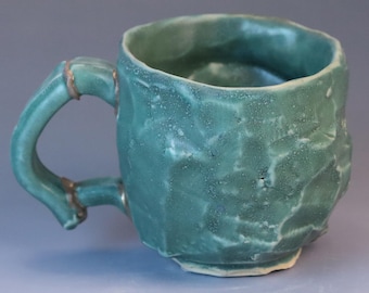 Handmade Green Ceramic Mug: Kintsugi Gold Detail, Kurinuki Style