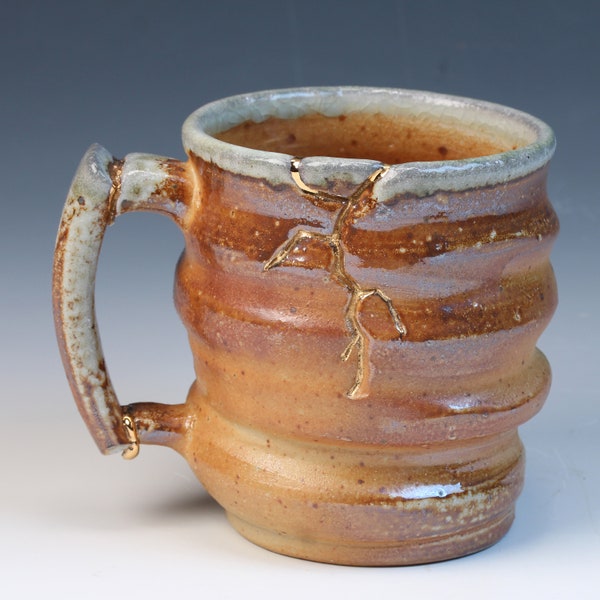 Wood and soda fired cone 10, wabi sabi and kintsugi inspired fully functional handcrafted ceramic coffee or tea mug with real gold luster