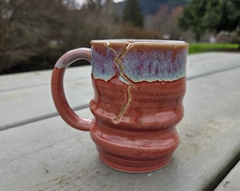 Kintsugi inspired, Wabi Sabi functional hand made and handcrafted plum and grey ceramic coffee or tea mug with 22k gold decorative repair