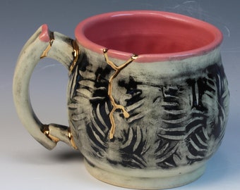 Kintsugi, Wabi Sabi inspired functional handmade pink, black & white ceramic coffee or tea mug with texture and decorative 22k gold repair