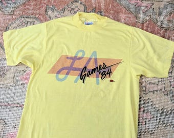 Vtg 80s LA Games '84 Yellow Graphic Single Stitch Tee Olympics T