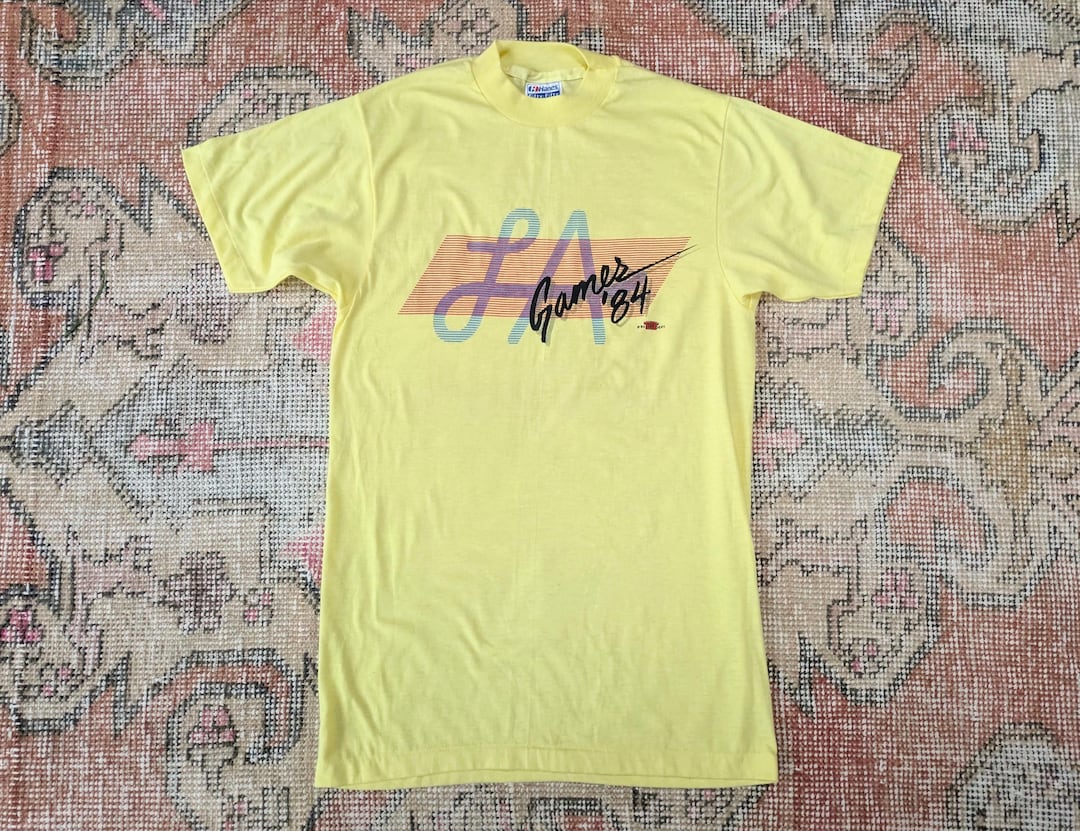 Vtg 80s LA Games '84 Yellow Graphic Single Stitch Tee Olympics T