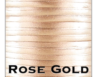 May include: Close-up of a spool of rose gold metallic cord. The cord is made of thin, flat strands that are woven together. The cord is shiny and has a metallic sheen.